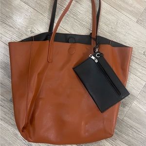 Reversible tote with detachable zipper pouch. Excellent condition.